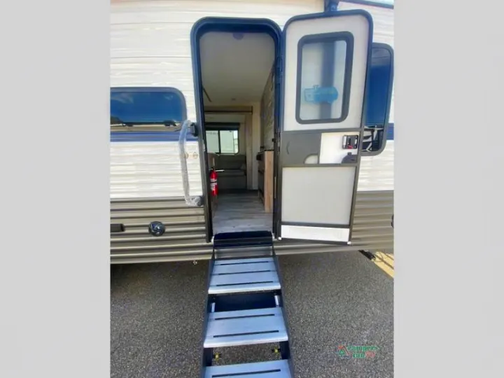 RV rental entrance view with open door and steps. See inside this travel trailer camper.. Gulf Stream Friendship 268BH 2024