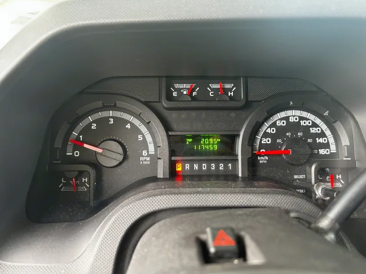 Dashboard of an RV rental shows full fuel, 117,459 km odometer, 209.5 km trip, and in Park (P).. Adventurer Adventurer Motorhome 2012