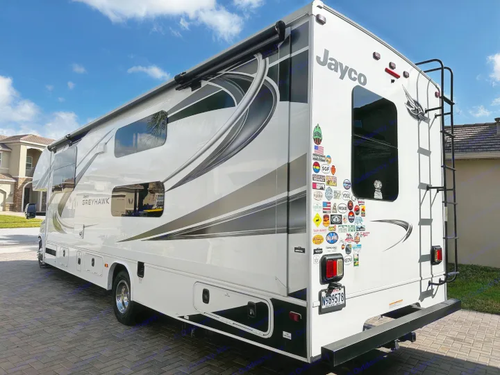 Jayco Greyhawk RV rental: a spacious motorhome covered in travel stickers, ready for your next road trip adventure.. Jayco Greyhawk 2021
