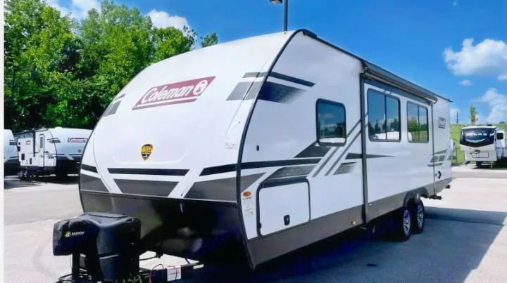 This white Coleman travel trailer with sleek graphics is perfect for your next RV rental trip.. Dutchmen Coleman Light 2023