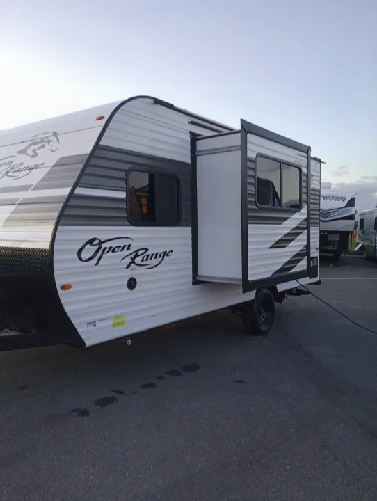 This white & black Open Range travel trailer with extended slide-out is ready for an rv rental adventure.. Highland Ridge RV Open Range 2022