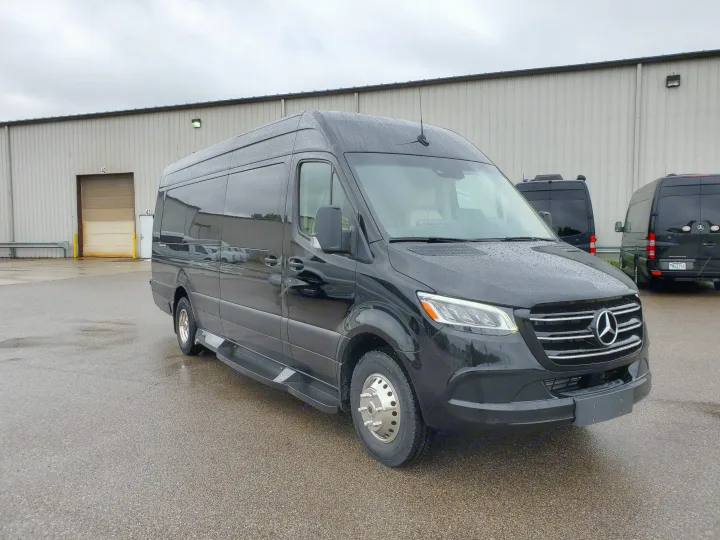 Black Mercedes-Benz Sprinter luxury van, great for rv rental, on a wet lot outside a commercial building.. Ultimate Toys 3500D 2025