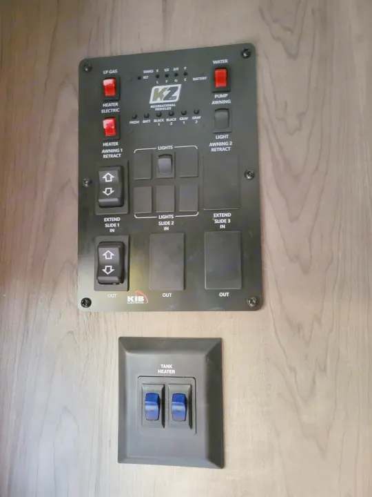 This RV rental control panel is a central hub for tank levels, water, heat, lights, awnings, and slide-out operations.. KZ Confluence 2022