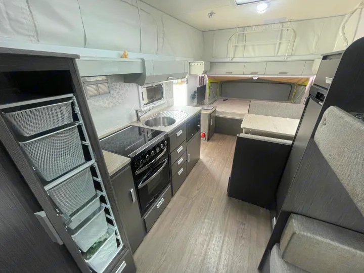 Explore this rv rental's clean, modern interior. Features full kitchen, dining nook, bed, and practical pull-out storage.. Jayco 17.56-2.OB.MY18 2018