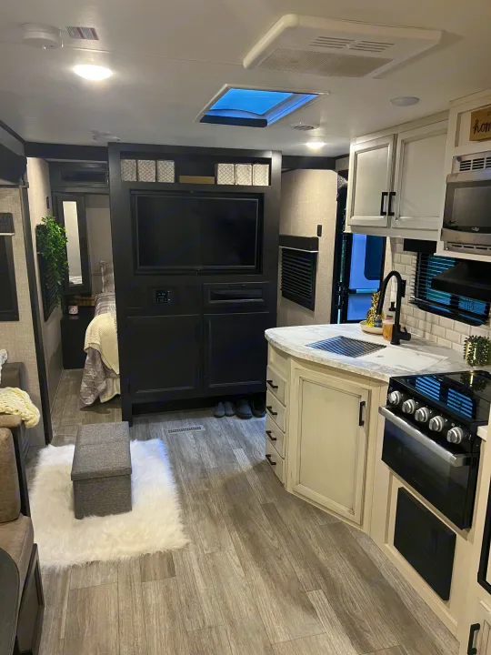 Spacious, modern RV rental interior with full kitchen, living area, and bedroom for comfortable travel.. Jayco Jay Flight 2022