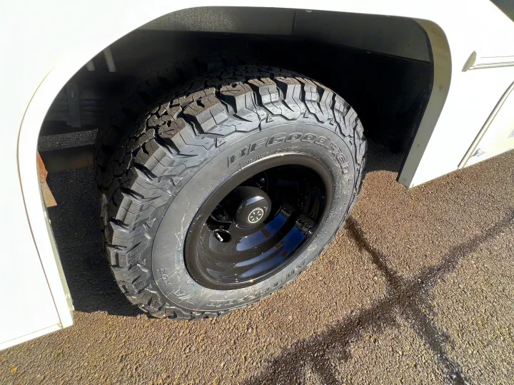 Durable BFGoodrich all-terrain tire and black wheel on an RV rental, ready for any road conditions.. Forest River Coachmen Freelander 2017