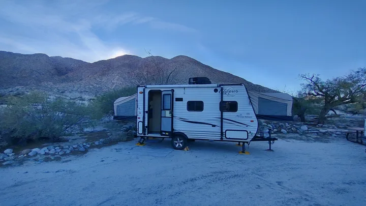 Enjoy an RV rental adventure! Travel trailer parked at a beautiful desert campsite with mountains under a bright sky.. Clipper Clipper Trailer 2016