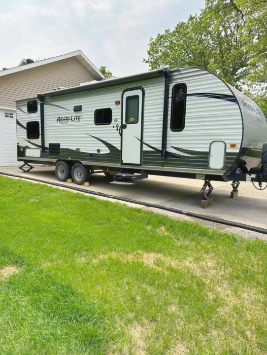 This spacious white Ameri-Lite travel trailer with black accents is ready for your next RV rental adventure.. Gulf Stream Ameri-Lite 2016