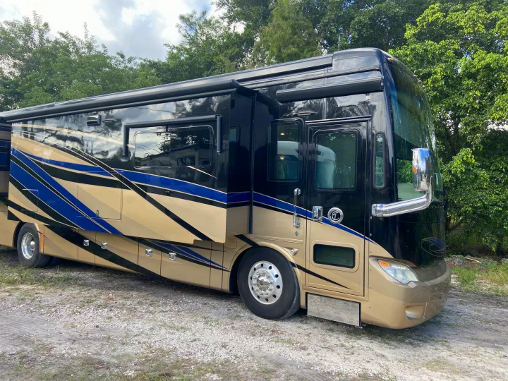 This elegant black and gold luxury RV is perfect for your next adventure. Explore the open road with our premium rv rental options.. Tiffin Motorhomes Allegro Bus 2017