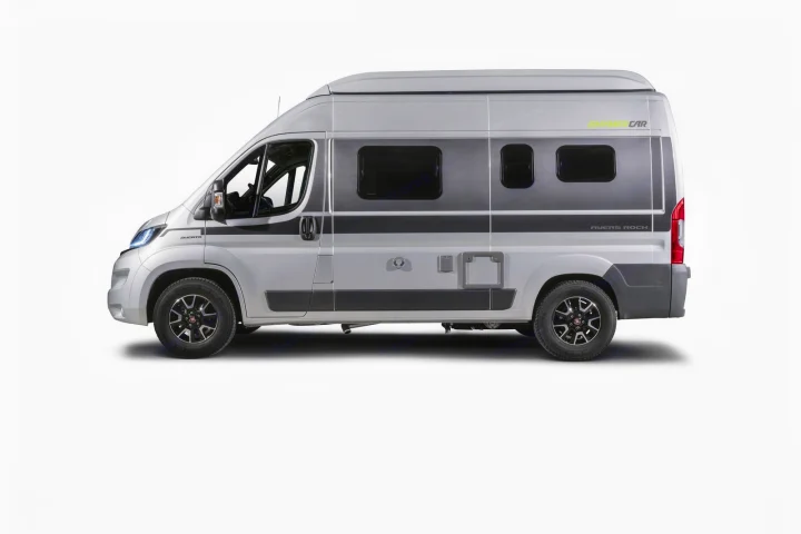 Side view of a modern light gray camper van with dark windows and gray accents, ready for your rv rental adventure.. Hymer Ayers Rock 2024
