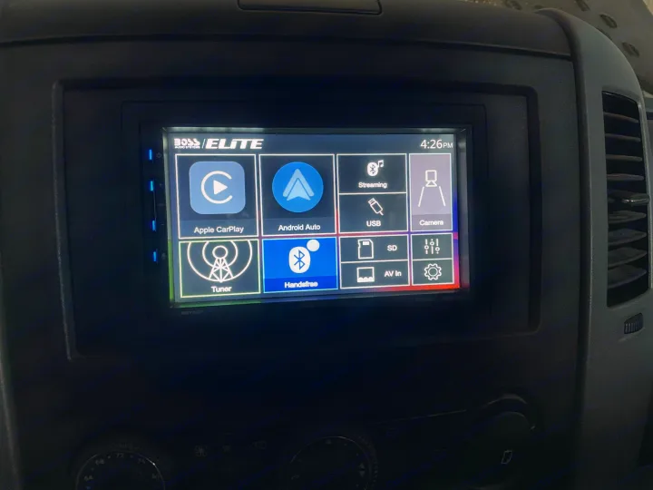 Inside an RV rental, a BOSS ELITE infotainment system displays Apple CarPlay, Android Auto, navigation, and media options.. Mercedes Sprinter 2017