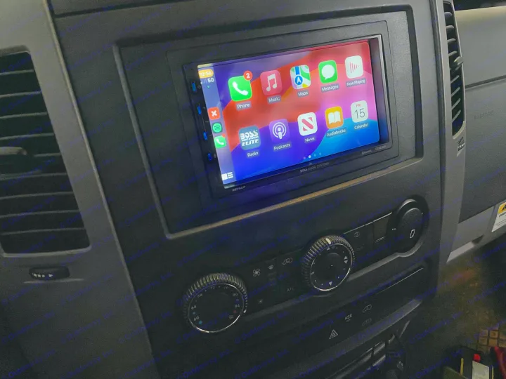 View of an RV rental dashboard with a Boss Audio CarPlay system displaying navigation and entertainment apps for your trip.. Mercedes Sprinter 2017