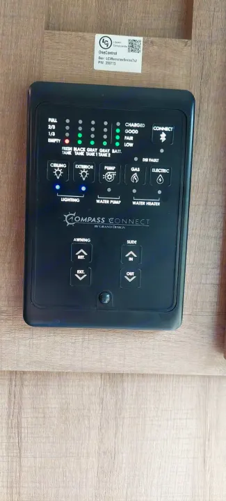 RV rental's Compass Connect panel: Monitor tank levels, battery, and control lighting, water pump, awning, slide.. Grand Design Imagine 2021