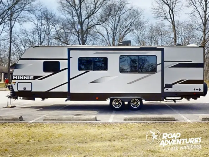 RV rental: A modern Winnebago Minnie travel trailer, white & grey, parked outdoors, ready for your next adventure.. Winnebago Minnie 2801BHS 2024