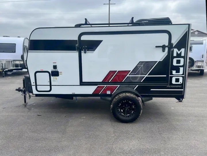 This compact, off-road capable MOJO travel trailer is ready for your next RV rental adventure. White with bold graphics.. Eclipse Recreational Vehicles Mojo-12 BD 2024