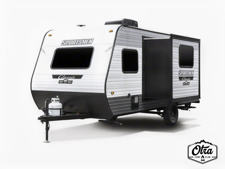 This white and black Sportsmen Classic travel trailer, with a unique open side, is ideal for your next RV rental adventure.. KZ SPORTSMEN CLASSIC 191BHK 2024