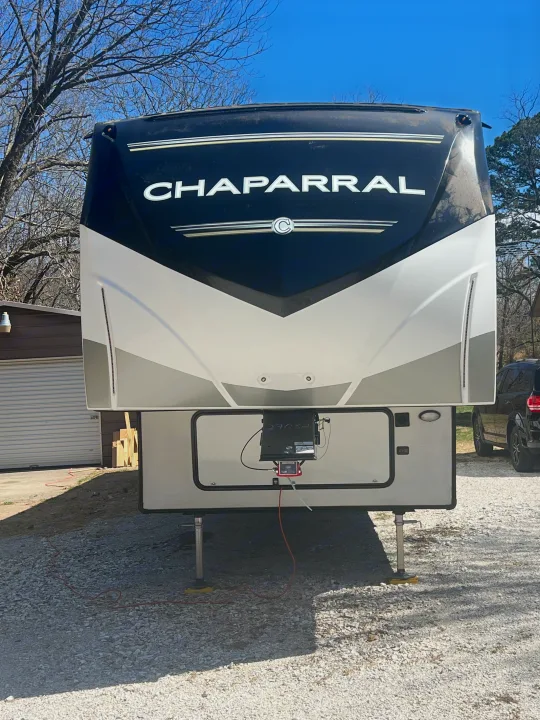Front of a large, modern Chaparral fifth-wheel RV, ready for your next rv rental adventure and outdoor journey.. Coachmen Chaparral 2021
