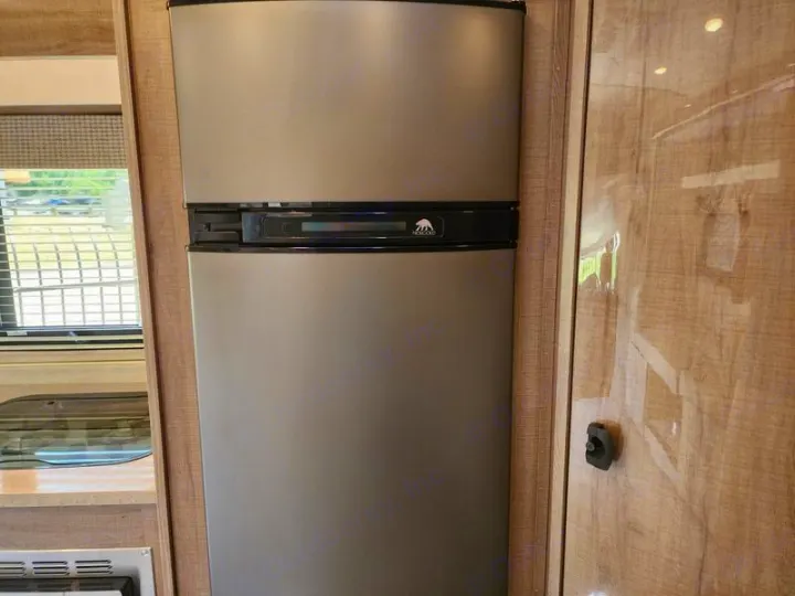 This RV rental features a compact Norcold refrigerator, essential for your on-the-road kitchen.. Entegra Coach Qwest 24L 2024