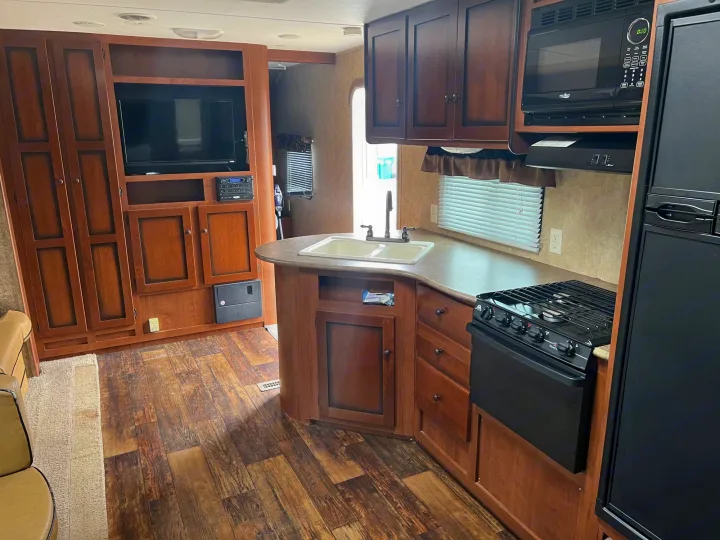 Double sink, triple burner, micro, fridge/freezer. Toaster, air fryer, drip coffee maker. silverware/cooking utensils, pots, pans, cups, plates etc. . Aspen Trail Aspen Trail Trailer 2014