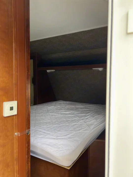 Queen bed/bedroom with door, closets storage and mirrors. . Aspen Trail Aspen Trail Trailer 2014