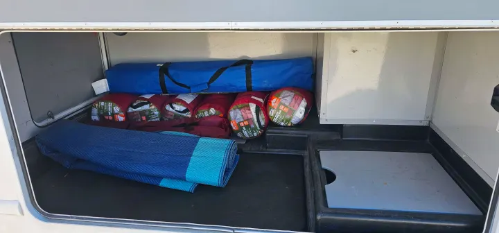 RV rental ready! Spacious storage compartment packed with sleeping bags, a tent, and an outdoor mat for your camping adventures.. Thor Majestic 2014