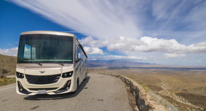 This Fortis RV rental is perfectly parked at a desert overlook, offering stunning mountain and valley views.. Fleetwood Fortis 2020