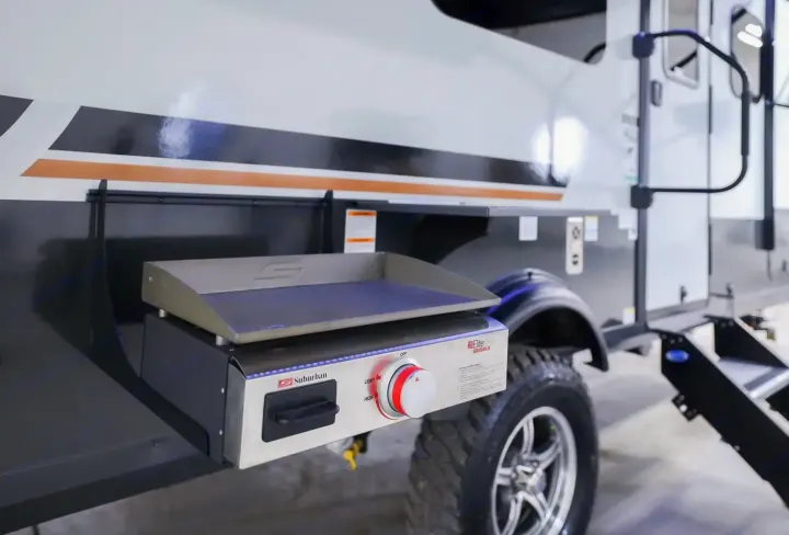 Outdoor cooking made easy! This RV rental features a Suburban Elite Griddle, perfect for delicious meals on your camping adventures.. Forest River Rockwood Geo Pro 2024