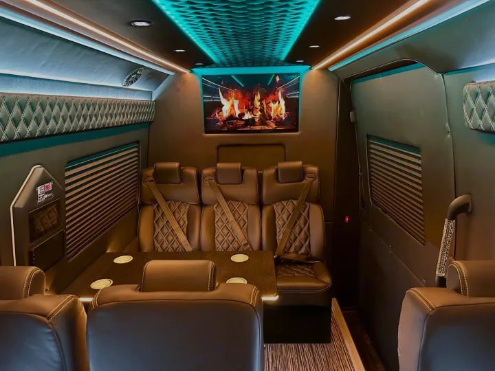This spacious RV rental features a luxury interior with quilted seating, a large entertainment screen, and serene ambient lighting.. Mercedes Benz Sprinter 3500XD 2024