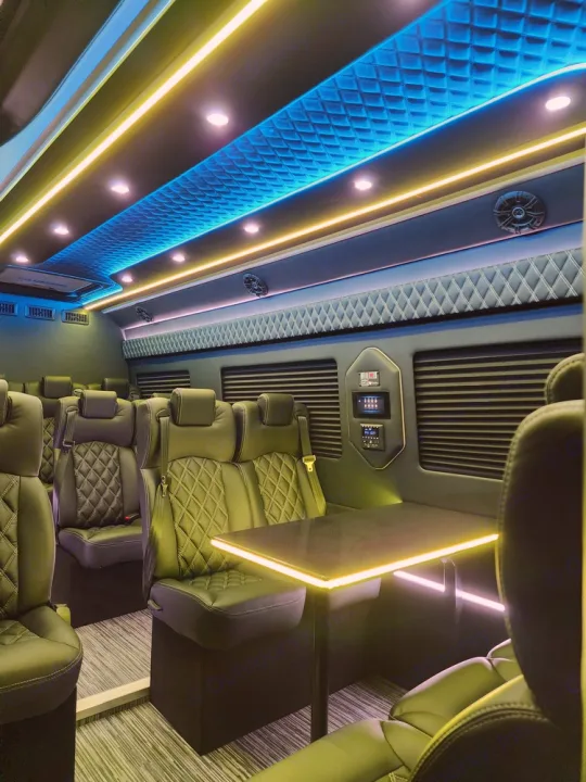Step inside this luxurious custom RV rental. Enjoy plush, quilted seating, ambient lighting, and a table for a premium travel experience.. Mercedes Benz Sprinter 3500XD 2024