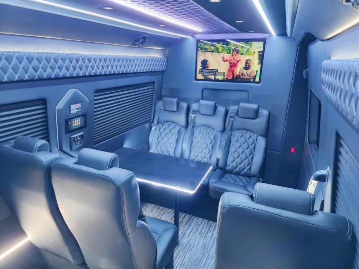 Step inside this luxurious RV rental: a spacious custom interior with quilted seating, dynamic lighting, and a large screen for entertainment.. Mercedes Benz Sprinter 3500XD 2024