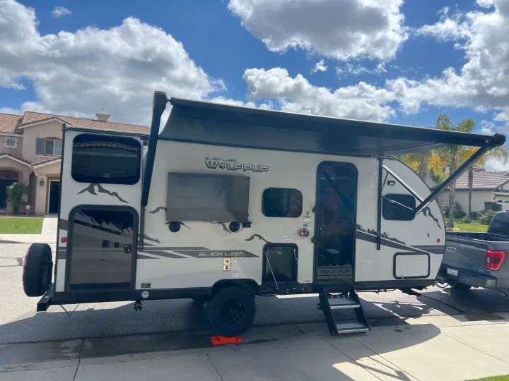 Ready for adventure! This Wolf Pup Black Label RV rental, with its extended awning and outdoor TV, is perfect for your next trip.. Forest River Cherokee Wolf Pup Black Label 2022