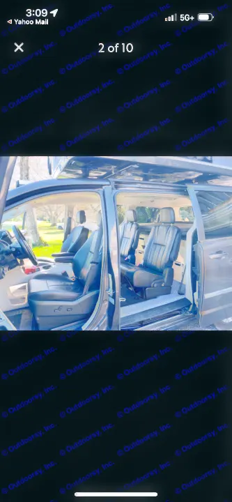RV rental minivan interior with black seats & open side door, revealing pop-top roof conversion. Great for travel.. Dodge Caravan 2015