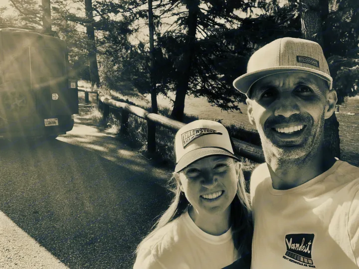 Smiling couple with their camper van rental on a scenic road, enjoying the outdoor adventure.. Vandoit Vandoit Class B 2020