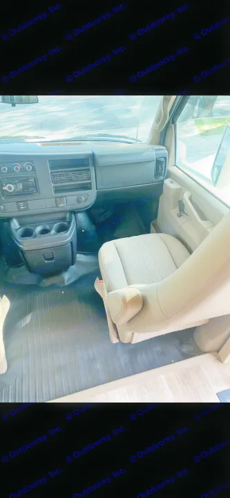 Spacious RV rental interior featuring the driver's seat, dashboard, controls, and floor. Ready for your journey.. Thor Four Winds 2018