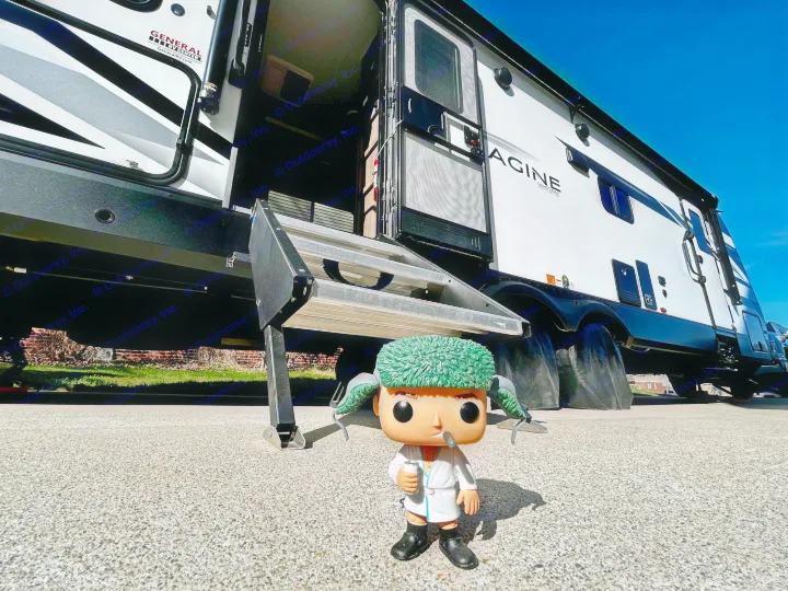 A Clark Griswold Funko Pop in robe holds a beer, eyeing an rv rental travel trailer under a bright sky.. Grand Design Imagine 2023