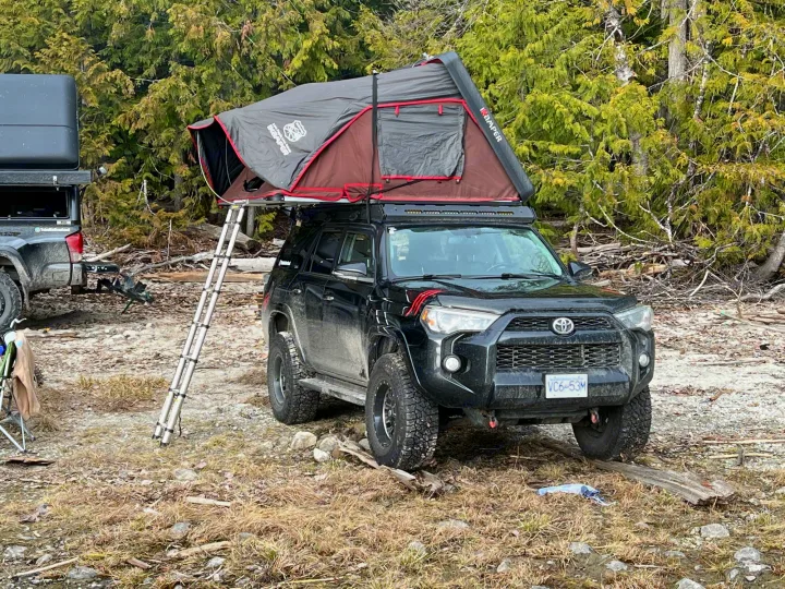 Black Toyota 4Runner with iKamper rooftop tent & ladder, ready for an RV rental overlanding adventure.. Toyota Other 2015