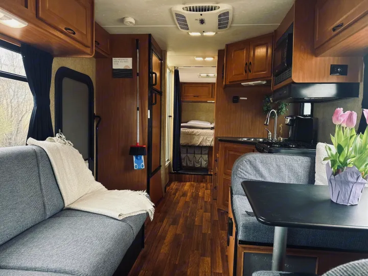 Step inside this comfortable RV rental! Features a well-equipped kitchen, dining area, and cozy living space.. Thor Majestic 2016