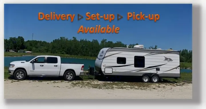 White pickup towing an RV rental travel trailer, with delivery, setup, and pickup services available.. Jayco Jay Flight SLX 2019