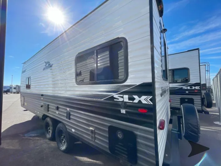 Side view of a grey and black Jay Flight SLX travel trailer, perfect for your next RV rental adventure.. Jayco Jay Flight 2024