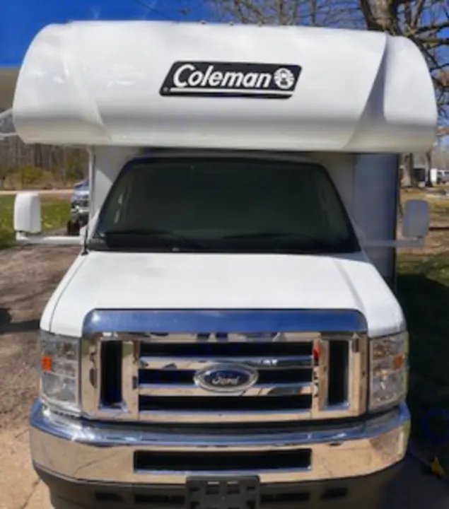 Front view of a white Coleman RV, likely a Class C with a Ford chassis, perfect for your next RV rental adventure.. Thor Coleman 2024