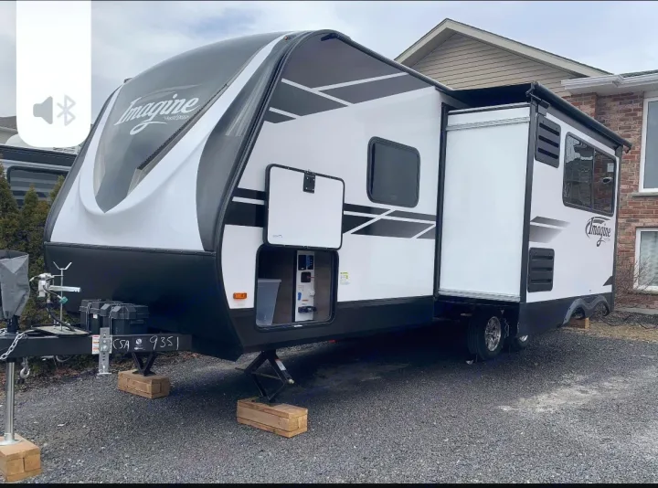 This modern white & black Imagine travel trailer is perfect for your next RV rental adventure or camping trip.. Grand Design imagine 2020
