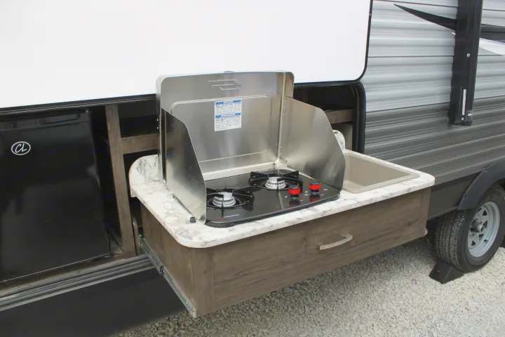 RV rental with pull-out outdoor kitchen, including a two-burner stove, sink, and mini-fridge, ideal for camping.. Jayco Jayflight SLX 8 2021
