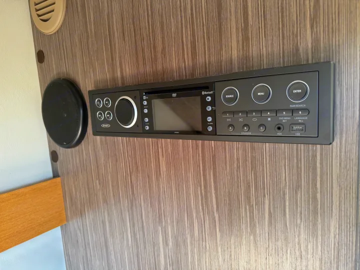 RV rental control panel: Jensen DVD/Bluetooth stereo with speaker & multiple inputs. Enjoy music on the road!. nuCamp T@B 2018