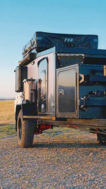 Rugged off-road camper trailer with a roof tent, ideal for your next RV rental adventure. Ready for remote camping.. Boreas XT 2023