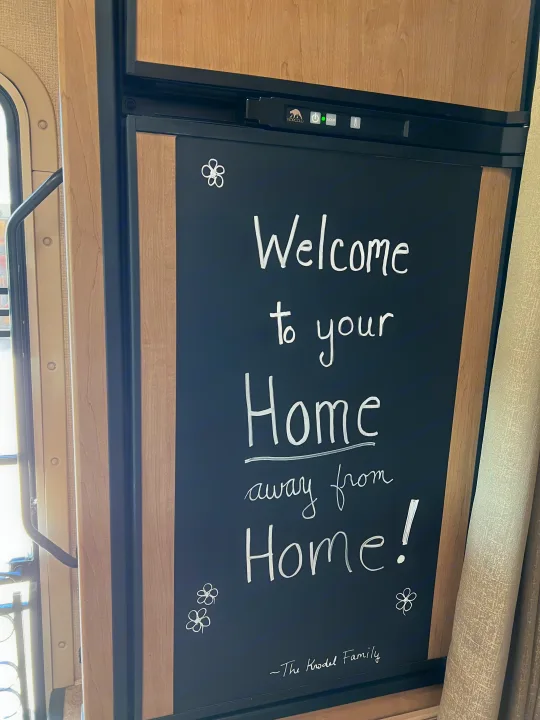 RV rental: Norcold fridge door displays 'Welcome to your Home away from Home!' from The Krodel Family.. Thor Chateau 2019