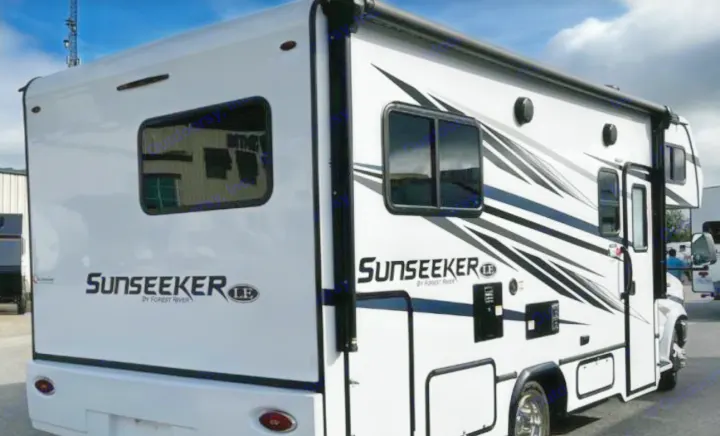 White Forest River Sunseeker LE motorhome. Explore with this RV rental, featuring sleek black graphics and tinted windows.. Forest River Sunseeker LE 2023