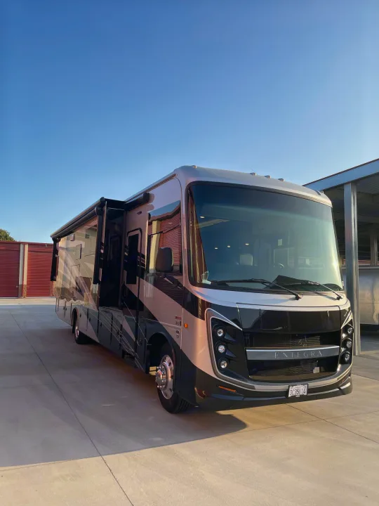 A sleek Entegra motorhome, with slide-out and awning out, is perfect for RV rental, offering luxury and comfort.. Entegra Coach Vision XL 2024