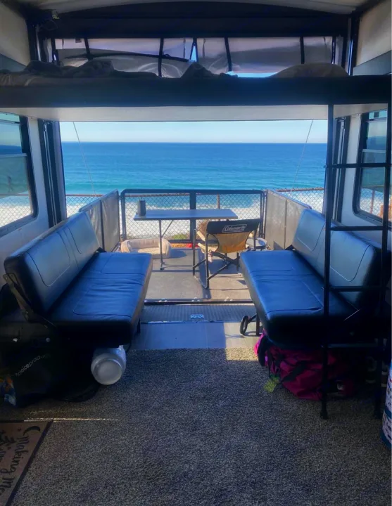 Experience an ocean view from this RV rental's rear deck, featuring comfortable seating and a bunk bed, perfect for beach camping.. Cruiser Rv Corp Stryker 2021