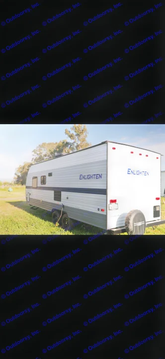 This Gulf Stream Enlighten travel trailer RV rental is parked in a scenic outdoor setting, ready for adventure.. Gulf Stream Enlighten 2022