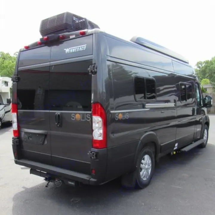 Dark gray Winnebago Solis camper van, a versatile RV rental. Rear/side view with roof AC unit for comfort.. Winnebago Solis 2023